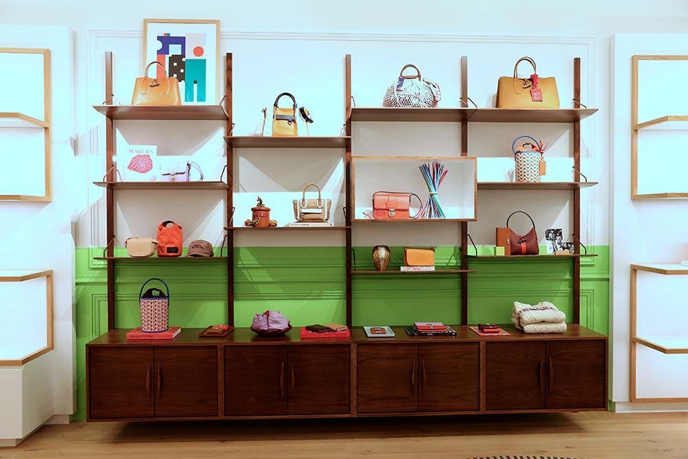 furniture handbag bag accessories shelf interior design indoors bookcase