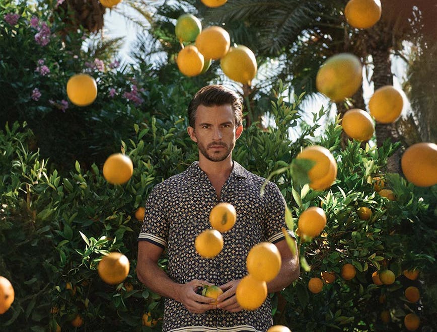 clothing sleeve citrus fruit fruit produce adult male man person shorts