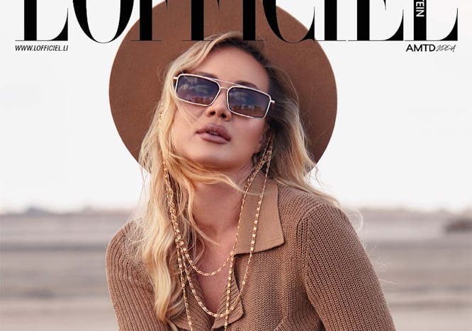 adult female person woman publication accessories knitwear sweater necklace sunglasses